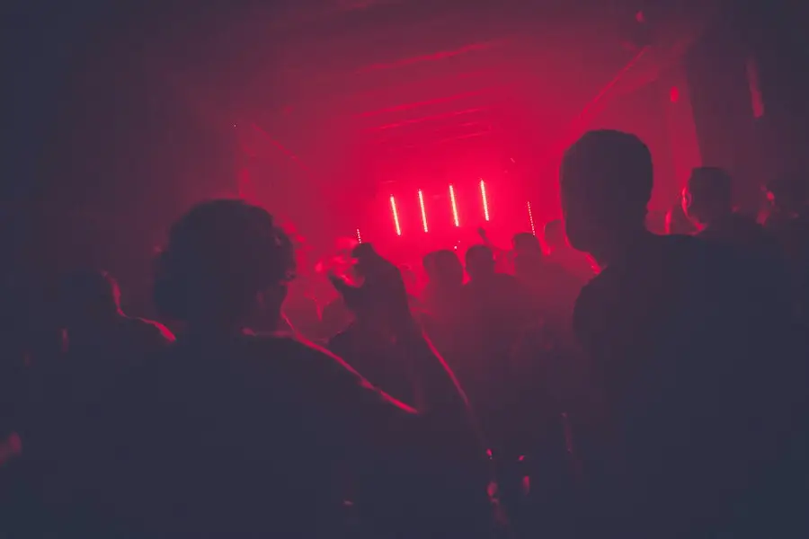 Hands on a DJ controller during a set